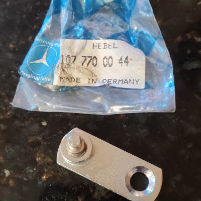Mercedes R107 Folding Top Lever  1077700044 NOS sealed bag